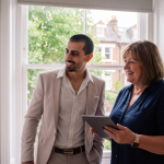 Two people discussing smart home upgrades